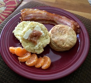 The bacon was pronounced good, too.  And her apple butter, on that biscuit half, is pretty superb.  (Sadly, the steam rising from the biscuit when it was split did not photograph well.)